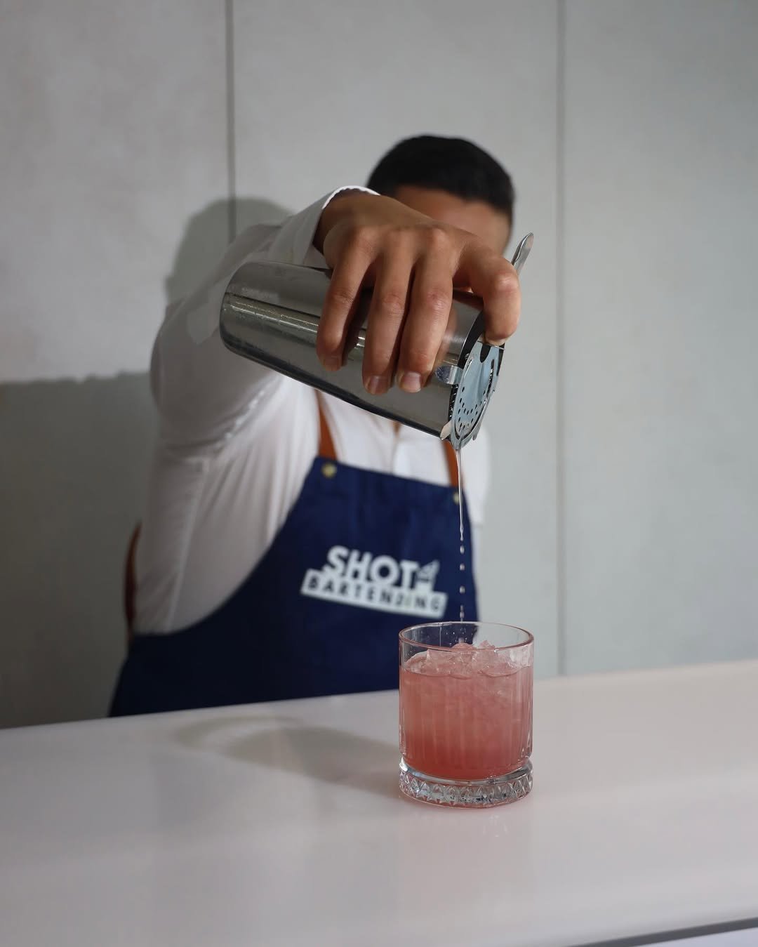 Shot Bartending bartender pouring a cocktail